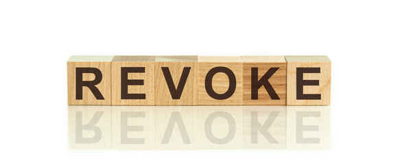 the word of REVOKE on building blocks concept, white background