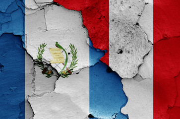 flags of Guatemala and Peru painted on cracked wall