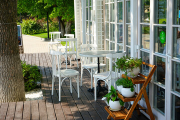 Fototapeta na wymiar pleasant atmosphere of summer cafes in parks on the shore of the mountain lake abrau dyurso