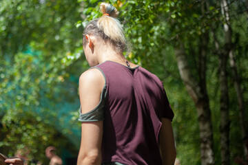 The guy at the festival in a torn t-shirt.