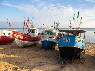 At Beach of Jaroslawiec in Poland fishing boats lie on the beach of the Baltic Sea