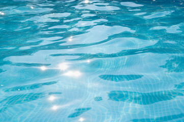 The surface of the water in the pool  as an abstract background. Selective focus.Texture.