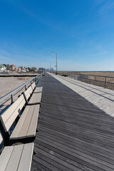 Looking Down Boardwalk Lined with Benches