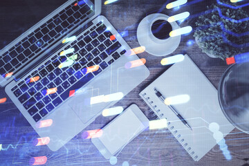 Multi exposure of data theme drawing hologram over topview work desk background with computer. Concept of technology.