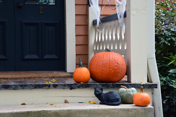 Halloween decorations on the front porch of a home.