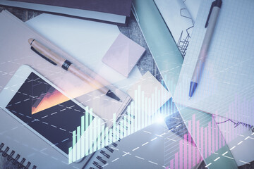 Fototapeta premium Multi exposure of forex graph hologram over desktop with phone. Top view. Mobile trade platform concept.