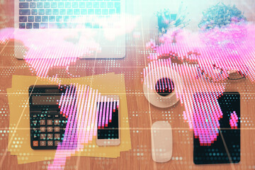 Double exposure of business theme hologram over desktop with phone. Top view. Mobile international...