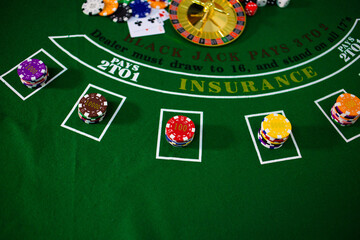 Casino equipment placed on the green floor for risky gambling for the people who want to get rich.