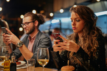 Group of friends having fun at restaurant.