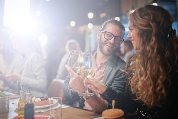 Group of friends having fun at restaurant.