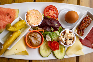 Directly above shot of meal served in plate on table at sidewalk cafe