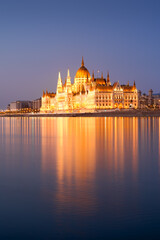 Fototapeta na wymiar Hungarian Parliament in Budapest reflecting in water. Night view