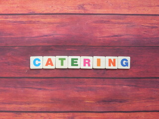 Word Catering on wood background