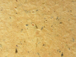 Yellow color Khakhra snack textured background