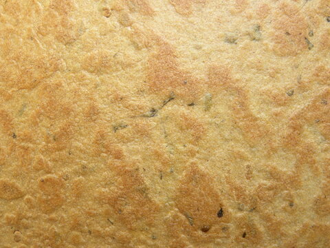 Yellow and brown color Khakhra snack textured background
