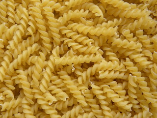 Yellow color raw Fusilli pasta