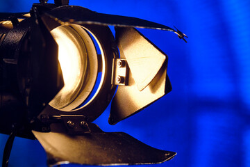 Close-up of a professional lighting fixture on a set or photographic studio. Concept of shooting a movie.