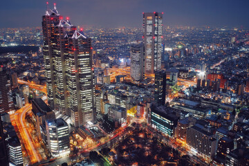 Obraz premium Tokyo, Japan Night View - Business city concept image, modern cityscape building in evening, Shot in Shinjuku Ward, Tokyo, Japan.