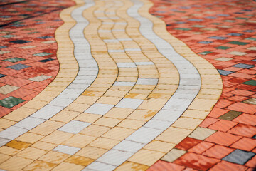 Stone pavement in perspective. Stone pavement texture. Granite cobblestoned pavement background. Abstract background of a cobblestone pavement