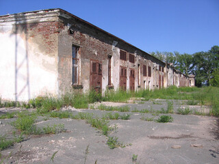 Old abandoned transformer station building with gates room for electrical equipment