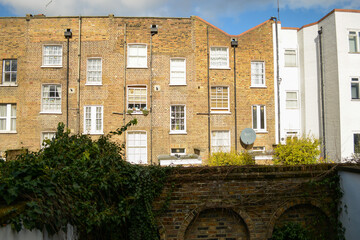 A variety of window decorate brick building facades in London 