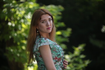 woman in green dress on nature  