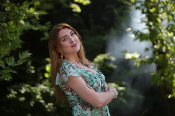 woman in green dress on nature  