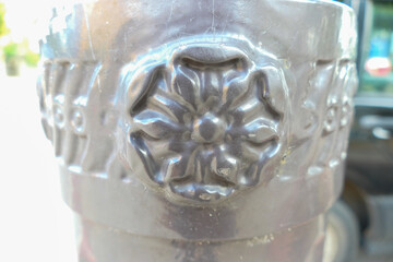Rosette on a metal pole