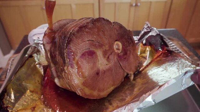 Cooking honey baked ham in a residential kitchen.