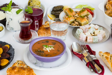 Traditional Turkish Tomato Soup with cheese and fresh mint garnised,close-up taken on Ramadan,Iftar Table.