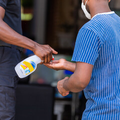 Close Up of a Man taking Alcohol to disinfect the hands