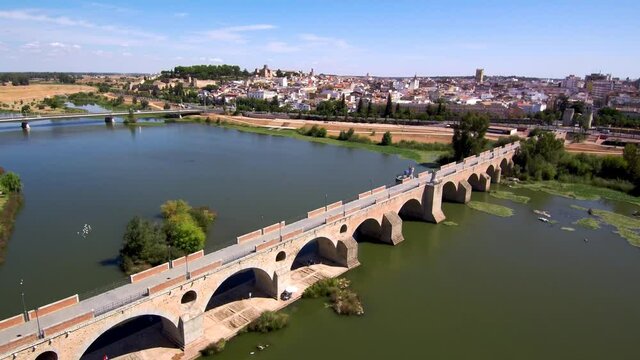 Aerial view of roman bridge in a river of city. Drone Footage