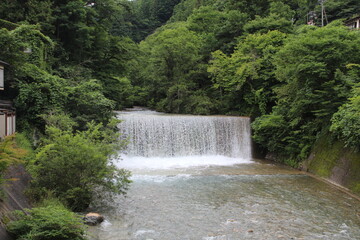 green waterfall landscape misty mountains Shima, Gunma, Japan
