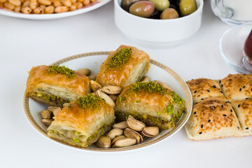 Traditional Turkish pistachio baklawa dessert on Ramadan table ,close up.