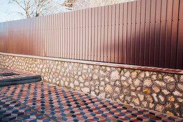 Stone pavement in perspective. Stone pavement texture. Granite cobblestoned pavement background. Abstract background of a cobblestone pavement