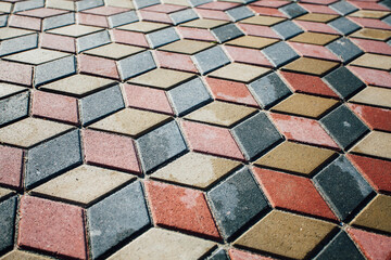 Stone pavement in perspective. Stone pavement texture. Granite cobblestoned pavement background. Abstract background of a cobblestone pavement