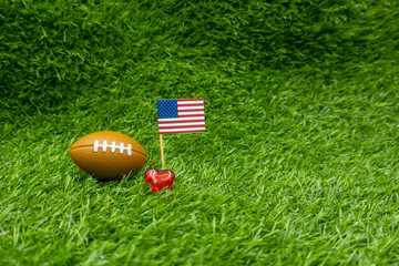 America football for soccer on green grass background