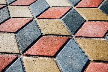 Stone pavement in perspective. Stone pavement texture. Granite cobblestoned pavement background. Abstract background of a cobblestone pavement