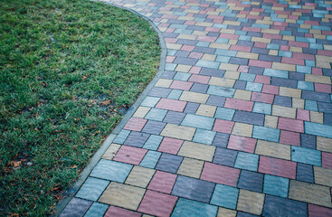 Stone pavement in perspective. Stone pavement texture. Granite cobblestoned pavement background....