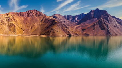colourful, warm mountains reflected in the lake