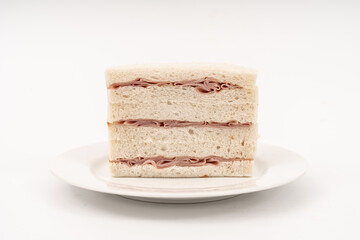 Sandwich made by white bread, ham and mayonnaise on white background.
