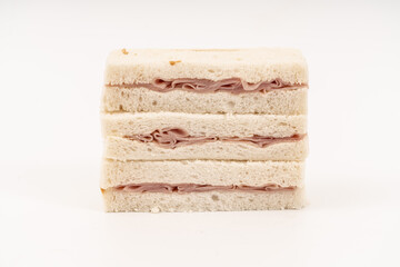 Sandwich made by white bread, ham and mayonnaise on white background.