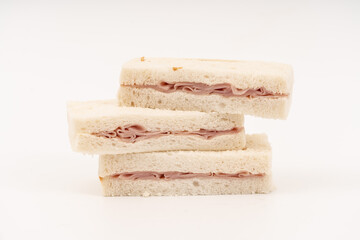 Sandwich made by white bread, ham and mayonnaise on white background.