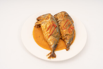 fresh Mackerel Thai food style with Dried Red Curry and Coconut milk Sauce, Chuchi mackerel, curry-fried fish on white background.