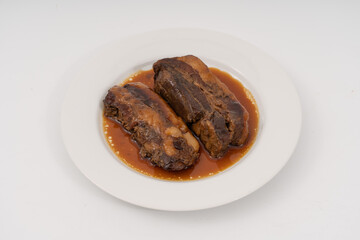 braised pork belly in a sweet soy sauce Japanese styles on white background.