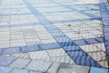 Stone pavement in perspective. Stone pavement texture. Granite cobblestoned pavement background. Abstract background of a cobblestone pavement