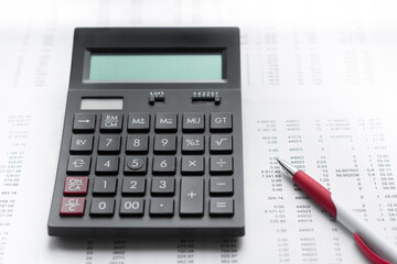 Financial activity, accounting, tax calculation or saving and investment, black calculator with pen