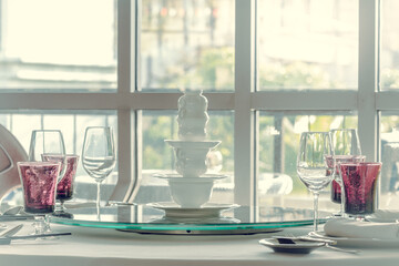 Glassware and ceramic set in hotel dining room