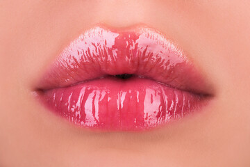 Sexy female lips with pink lipstick. Sensual womens open mouths. Red lip with glossy lipgloss. Seductive lips of a young woman. - obrazy, fototapety, plakaty