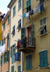 Fototapeta na wymiar hanging laundry out the window and balcony to dry 
